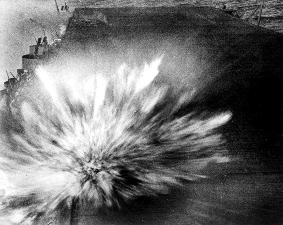 Japanese bomb hits USS Enterprise (CV-6) flight deck during Battle of the Eastern Solomons, 24 August 1942 (80-G-17489)