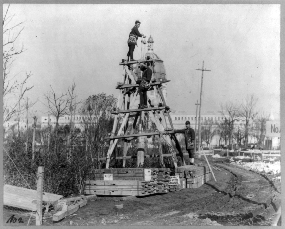 Japanese carpenters and stone masons in distinctive native attire starting to construct Japanese Pavilion at World's Columbian Exposition, Chicago, 1893- 3 men on homemade wooden pile driver LCCN2005675982