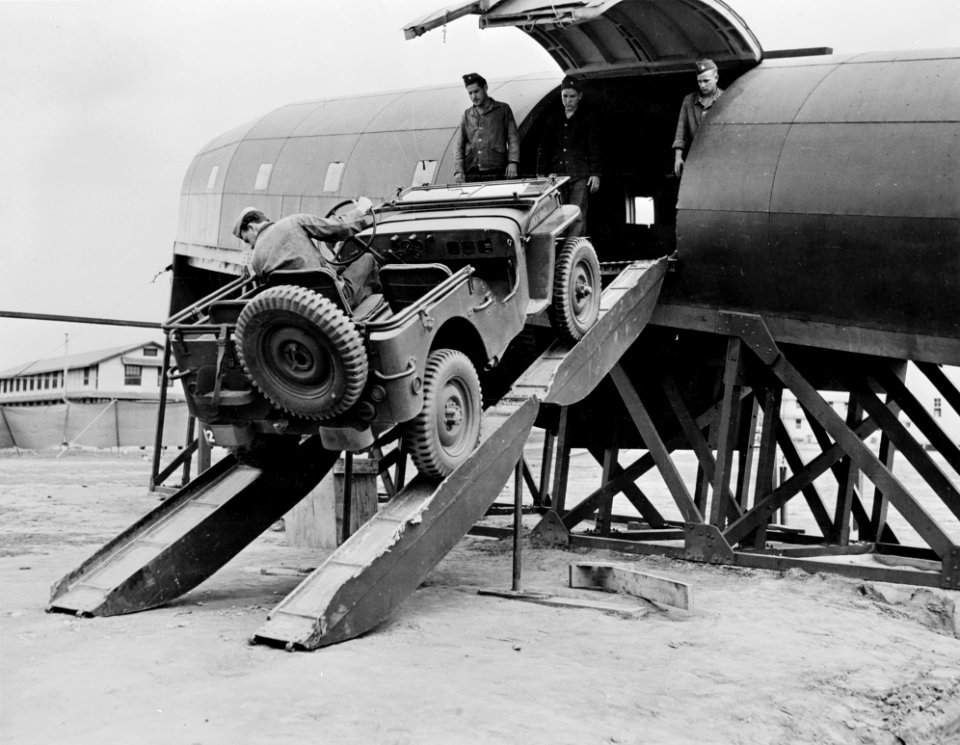 Jeep is loaded in mockup plane at Ft Benning c1942