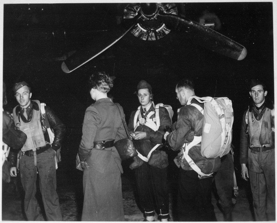 Jedburghs in front of B-24 just before night takeoff. Area T, Harrington Airdrome, England, circa 1944. - NARA - 540066