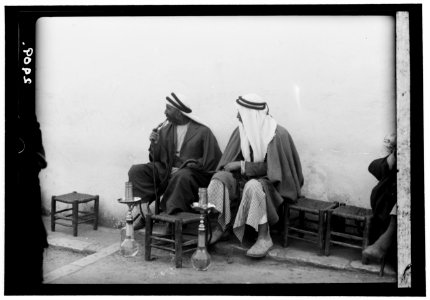 Jerusalem. The Old City. Street coffee shop. Men smoking nargilies LOC matpc.15158