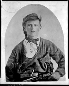 Jesse James, half-length portrait, facing front, holding handgun in left hand at his waist LCCN2005682818