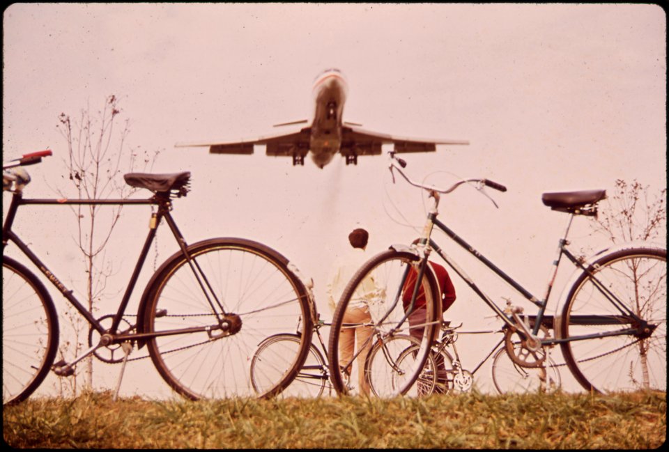 Jet Roars over Bicycle Path near Washington's Nation Airport. Noise-Decibel Level from Aircraft at This Altitude Can Cause Permanent Ear Damage. 11-1972 (3769042907)
