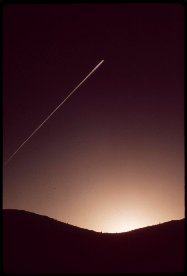 Jet-contrail-over-the-mountains-of-searchlight-desert-air-here-is-free-of-smog-may-1972 7006932524 o
