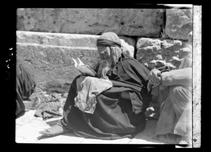 Jewish beggar at the Wailing Wall reading LOC matpc.15658