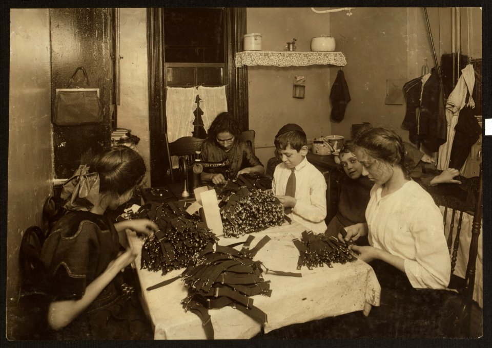 Jewish family working on garters in kitchen for tenement home. (For complete details see Miss E.C. Watson's report.) LOC cph.3a38584