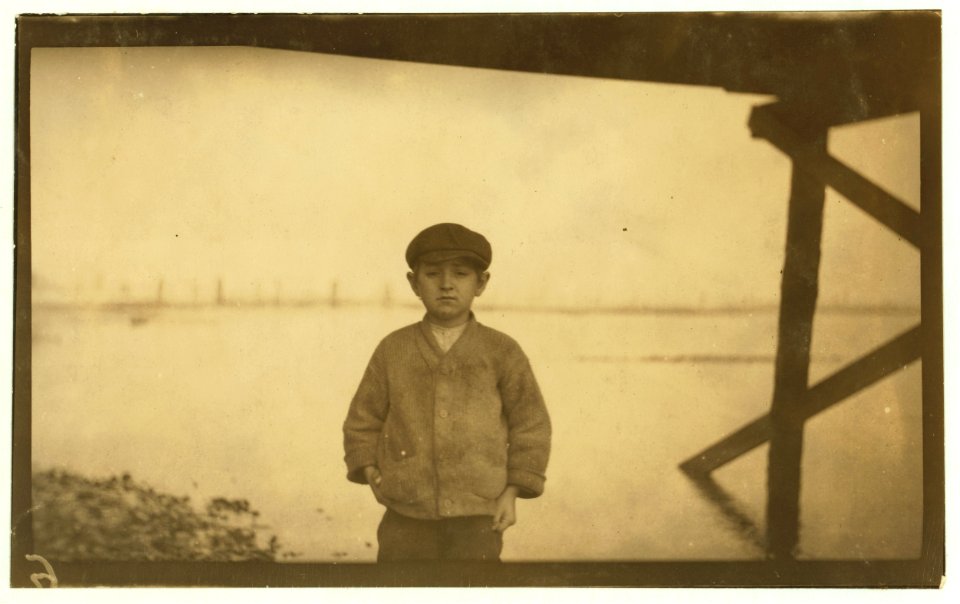 Joe Davis, a ten-year old going home from cannery at 5 P.M. He said he had shucked ten pots since 4 A.M. that day. LOC nclc.01037