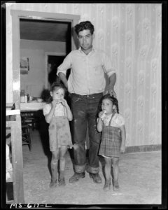 Joe L. Montoya, miner, and two of his children. Royal Coal Company, Royal Mine, Carbon County, Utah. - NARA - 540530