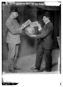 Joe Tinker receiving medicine ball sent by Continuation School 1913 LCCN2014692230