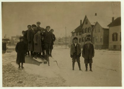 Jo and Antone are standing apart from the school boys. LOC nclc.02481