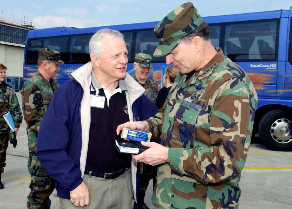 Joe Knollenberg presents Gregory Martin with a memento