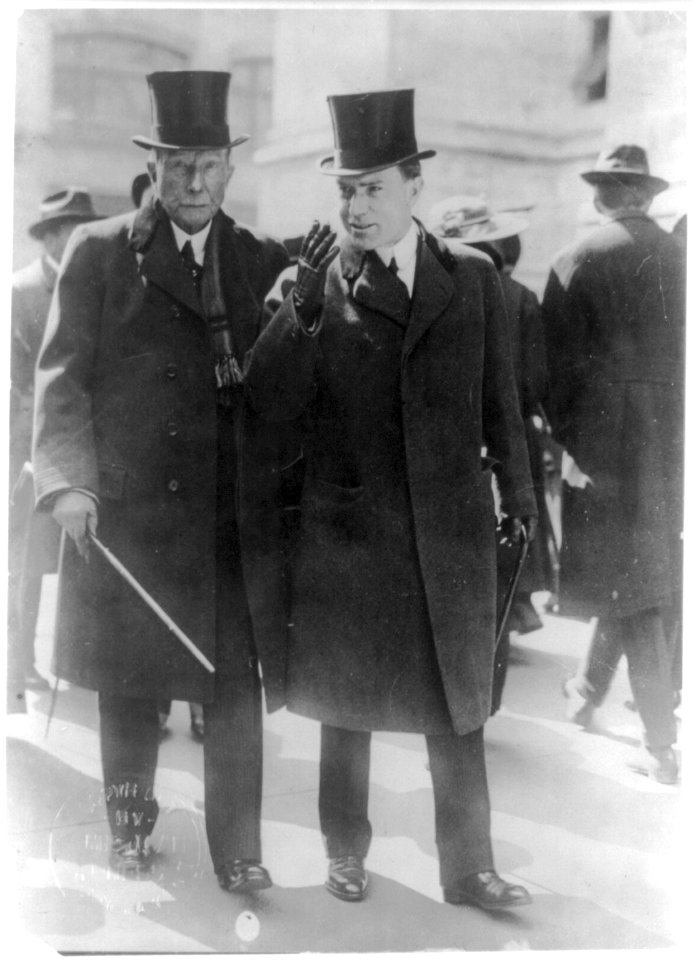 John D. Rockefeller, full-length portrait, walking on street with John D. Rockefeller, Jr. LCCN2005685460