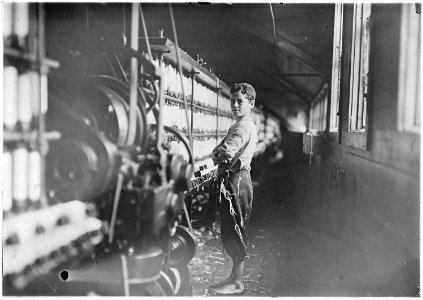 John Dempsey, (looked 11 or 12 years old). Said he only helped on Saturdays. Jackson Mill. He was working faithfully... - NARA - 523183 photo