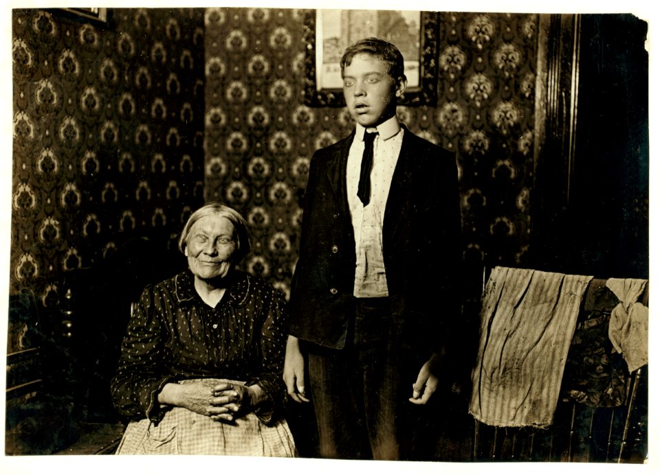 John F-- and his grandmother, who live in an attic in Cincinnati. John is 15 years old and works in a glass factory. LOC nclc.05351