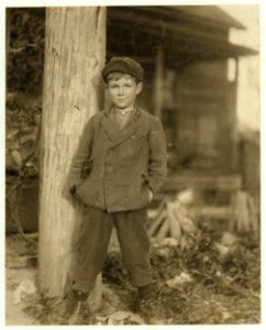 John Holland. Said he was 10 years old. Has had a regular job for some months rolling bobbins in the Deep River Mill. Been helping the father and brother a year. LOC nclc.02835 photo