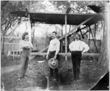 John L. Sullivan, Peter McCoy, and Joseph Goss posed full length, standing, outdoors LCCN2003663428