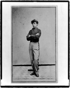 John Longnecker, full-length portrait, standing, with arms folded across chest, facing left LCCN98506725
