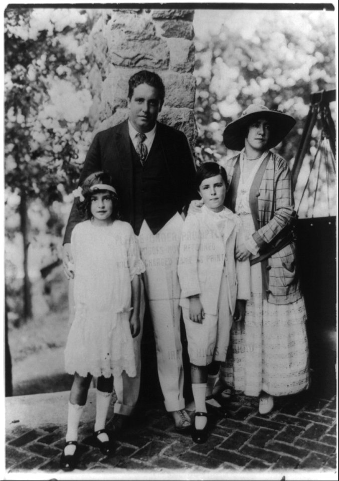 John McCormack, full-length portrait, standing, with wife and two children LCCN93510019