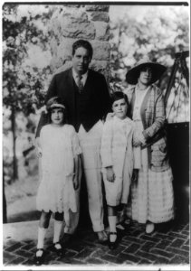 John McCormack, full-length portrait, standing, with wife and two children LCCN93510019