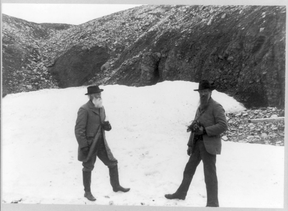 John Muir and John Burroughs, full-length portrait, standing on snow LCCN95514642