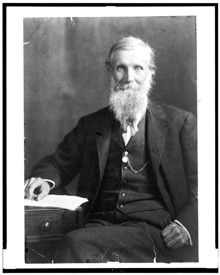 John Muir, three-quarter length portrait, seated, facing front LCCN93505505