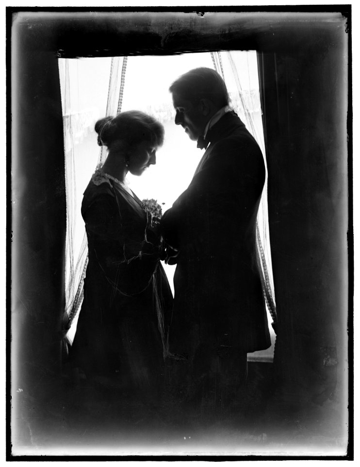 John Murray Anderson, the theatrical producer, and his wife posed at a window LCCN2006684238