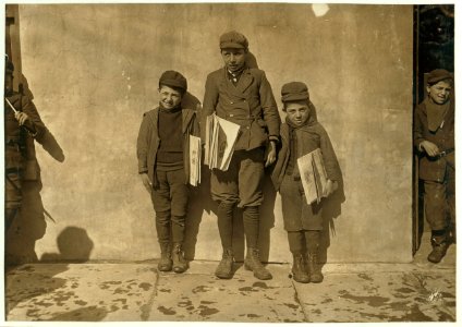John Pento, 14 years old, has been selling for 7 years. Daniel and Angelo, are his twin brothers. They are 7 years old and been selling one year. Sell until 8 P.M. some nights. LOC cph.3b44832