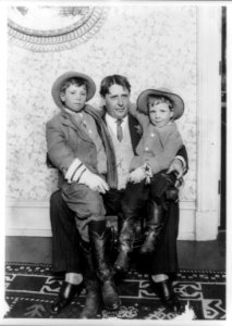 John Reeves Abernathy, full-length portrait, seated, holding his two sons, Louis Van Abernathy and Temple Reeves Abernathy LCCN90708064