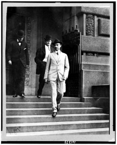 John Purroy Mitchel, full-length, facing left, walking down steps with two other men LCCN90711309