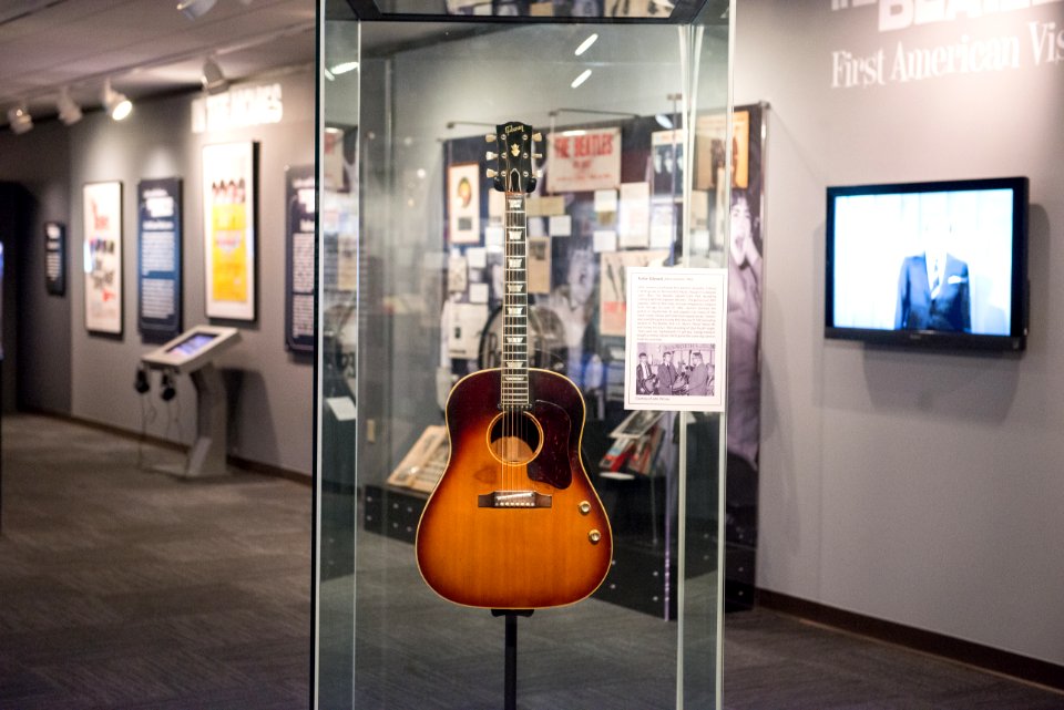 John Lennon's missing 1962 Gibson J-160E guitar in the exhibit - Ladies and Gentlemen... the Beatles! exhibit at LBJ Presidential Library, Austin, TX, 2015-06-12 11.37.55