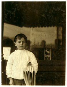 Johnnie Merkle 6 yr. Old newsie. Home of Johnnie Merkle, 5110 N. Broadway. Father owns this home and a butcher shop. Johnnie's brother owns and runs a nickelode(o)n. LOC nclc.03522