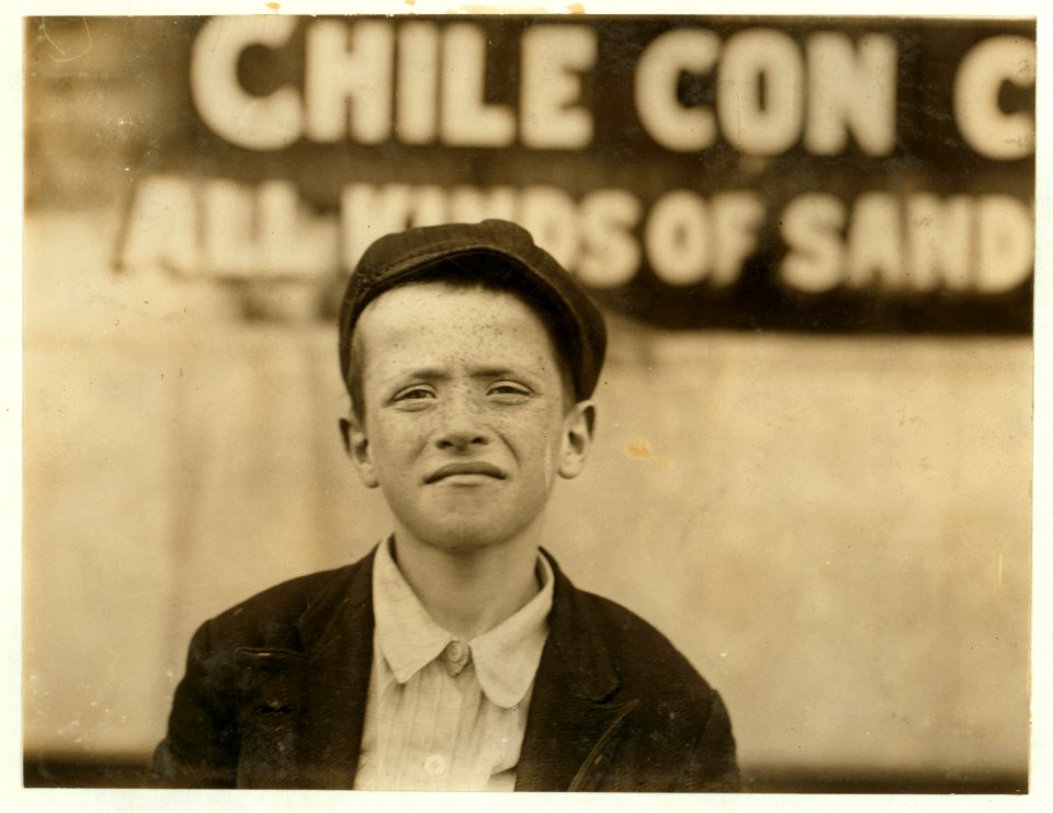 Johnnie Burns a newsie who sells on Grand Avenue. 9 years old. Father says he is uncontrollable. May 9th, 1910. Father also said his 4 yr. old. twins would be selling soon. LOC nclc.03493
