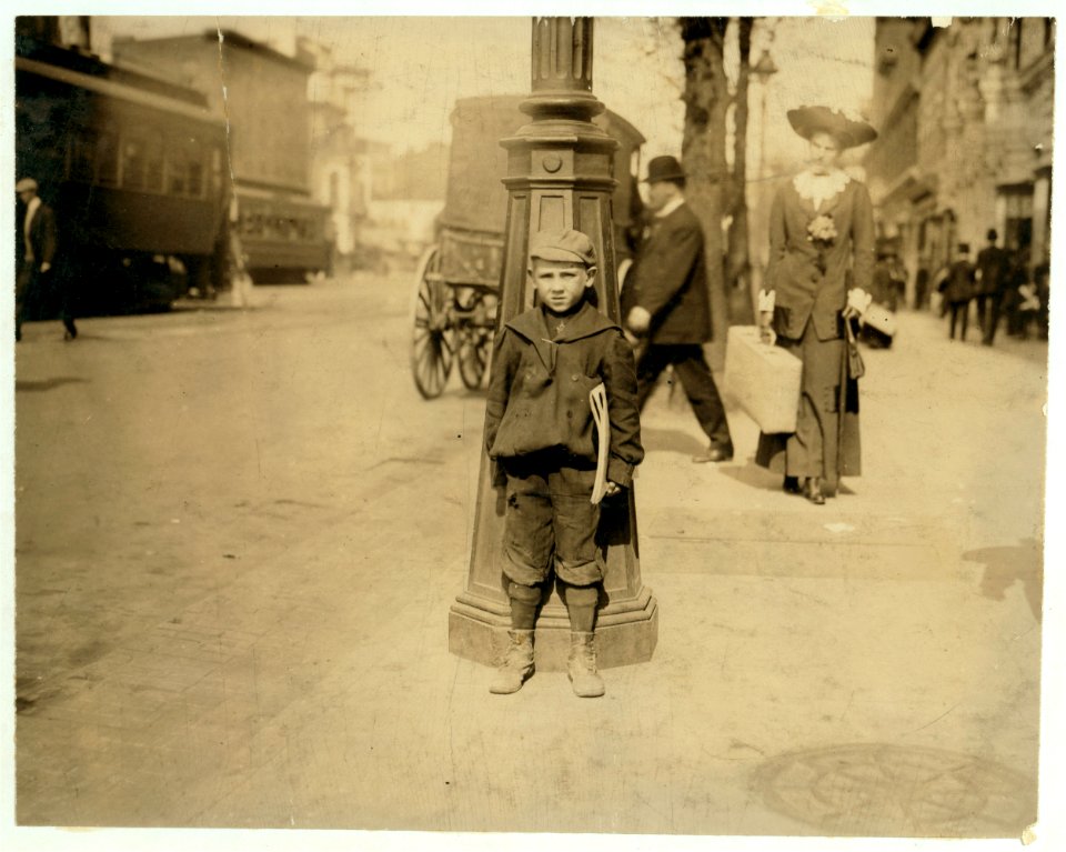 Johnnie Garvin, 7 yrs. old newsie. 'I help Bruver.' Lives 928 Twenty Sixth St., N.W., Washington, D.C. The brother, Martin, has a badge. LOC nclc.03751