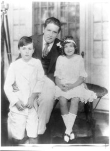 John McCormack, full-length portrait, seated, with two children LCCN93510018 photo