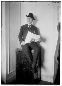 Johnson (seated on a trunk, reading newspaper) LCCN2014713993