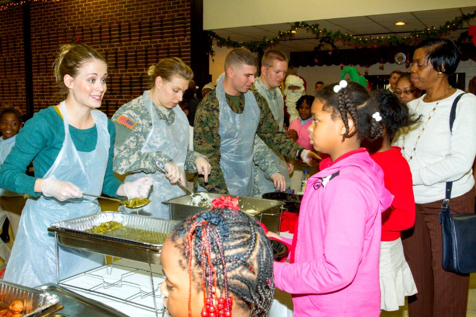 Joint Base volunteers, police and Toys for Tots help disadvantaged youth 131218-N-WY366-006