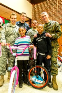 Joint Base volunteers, police and Toys for Tots help disadvantaged youth 131218-N-WY366-007