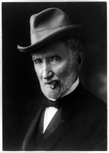 Joseph Joe G. Cannon, bust portrait, with cigar in his mouth LCCN2016651346