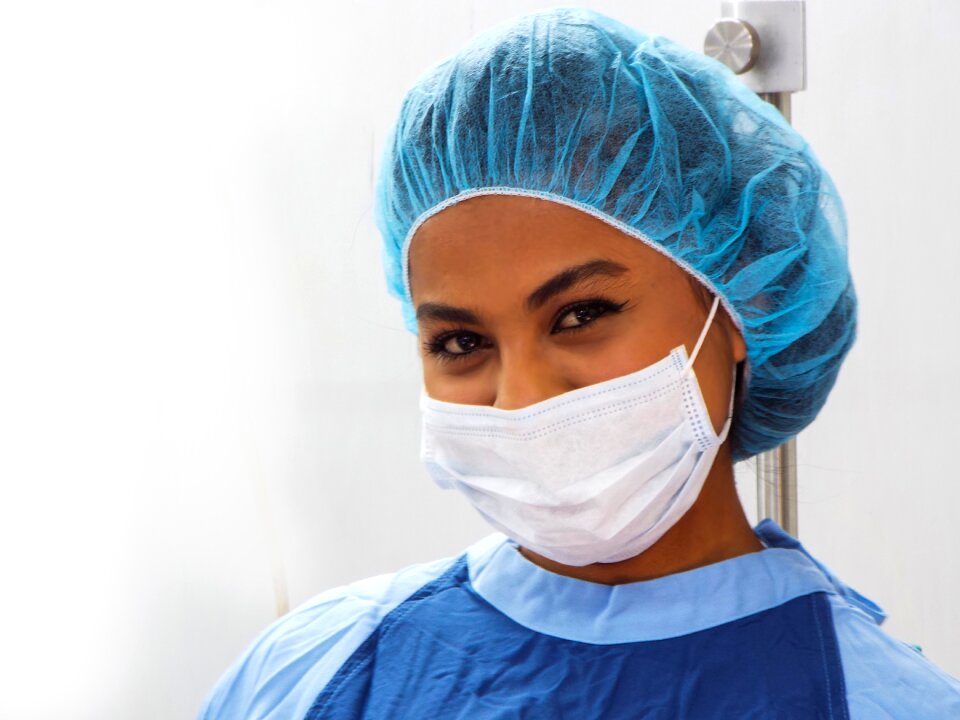 Operating room personnel using mask
