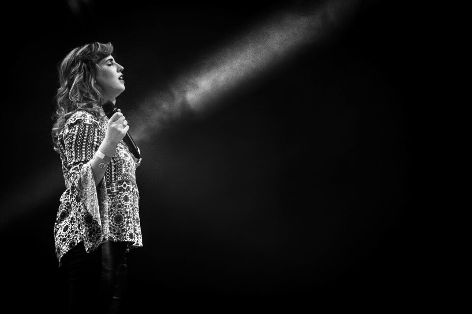 Dark spotlight singing
