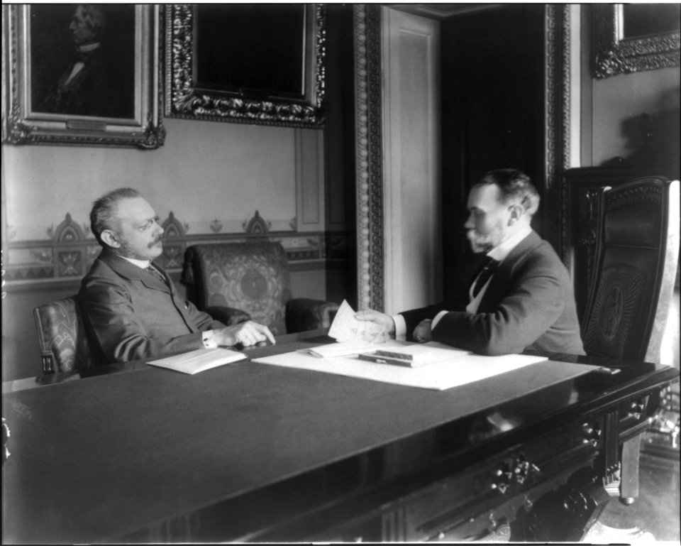 Jules Martin Cambron, 1845-1935, and John Milton Hay, 1838-1905, at exchange of our payment to Spain of 20 million for Philippine Islands LCCN2005688544