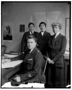 Julia Stimson, Chief of the Army Nurse Corps, seated at desk; with unidentified persons LCCN2016870916