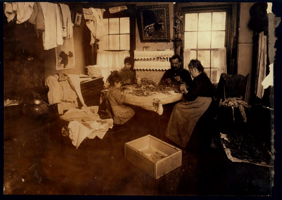 Julin, a six-year-old child, making pansies for her neighbors on top floor (Gatto), 106 Thompson Street, N.Y. They said she does this every day, 'but not all day.' A growler and dirty beer LOC cph.3a38582