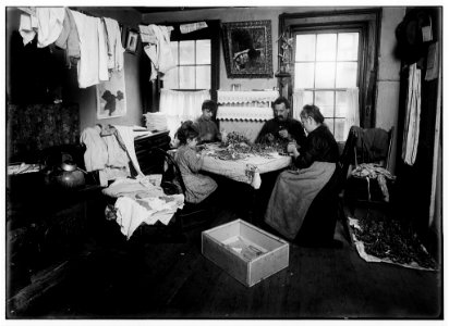Julin, a six-year-old child, making pansies for her neighbors on top floor (Gatto), 106 Thompson Street, N.Y. They said she does this every day, 'but not all day.' A growler and dirty beer LOC cph.3a38582