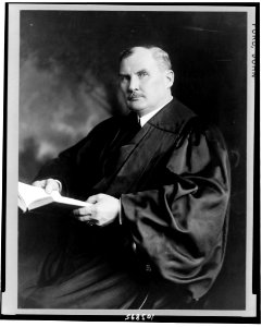 Justice John Ford, three-quarter-length portrait, seated, facing left, wearing robe LCCN91789084