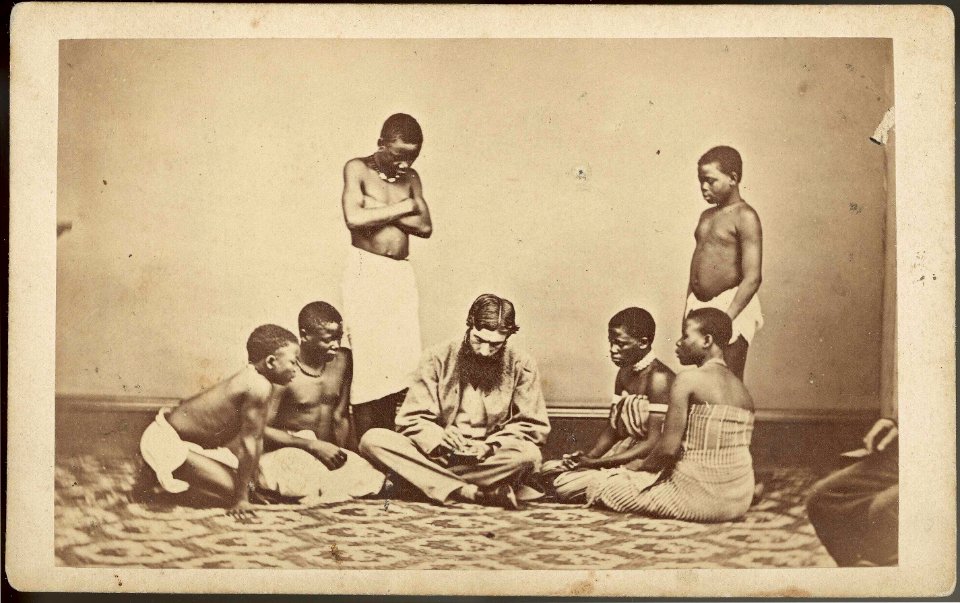 Kaffir Girls watching a Missionary counting money RMG E9088