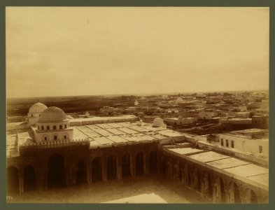 Kairouan. Bird's-eye view taken from top of the minaret of the Grand Mosque showing the mosque proper and the cloisters of the great courtyard - Lehnert et Landrock, Tunis. LCCN2003690048