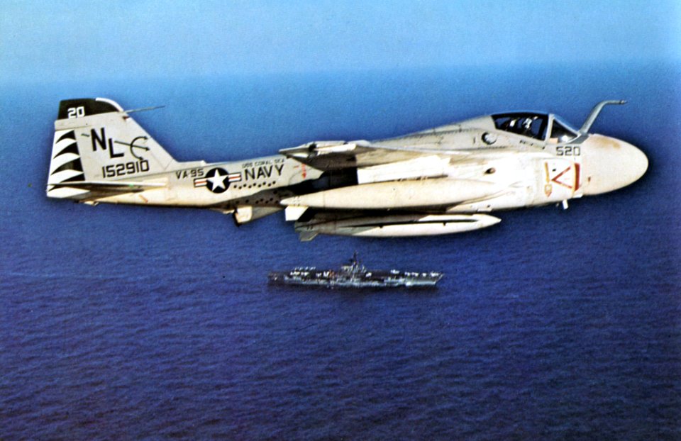 KA-6D Intruder of VA-95 in flight over USS Coral Sea (CVA-43), in 1973