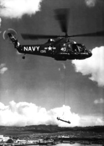 Kaman UH-2B Seasprite of HU-1 lifting a torpedo c1965