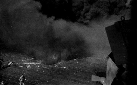Kamikaze damage on the flight deck of USS Ticonderoga (CV-14), 21 January 1945